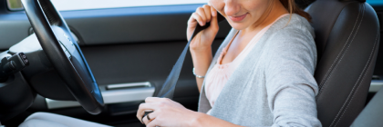 A lady in car wearing seat belts