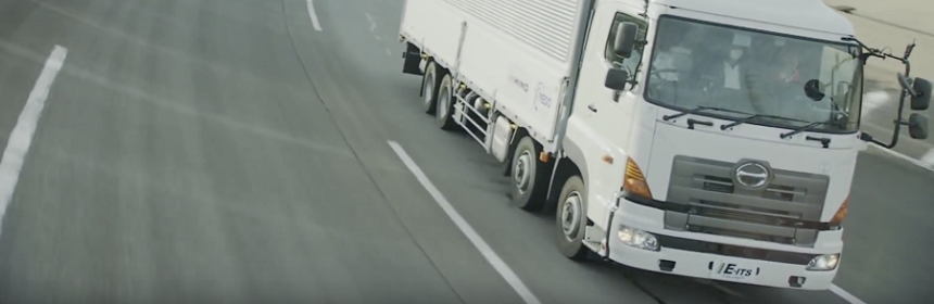 Image of white color truck in road